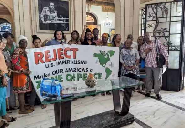 Black Alliance for Peace members hold a “Make Our America a Zone of Peace campaign” banner along with members of Instituto Cubano de Amistad con los Pueblos (ICAP). Habana, Cuba, April 2023. Photo: Black Alliance for Peace/file photo.