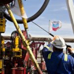 Oil worker operating a drill at a PDVSA/Chevron rig in Venezuela. Photo: Daniel Acker/Bloomberg.