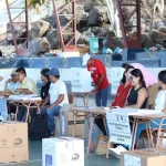 People voting at a polling station in Ecuador. Photo: National Electoral Council of Ecuador.