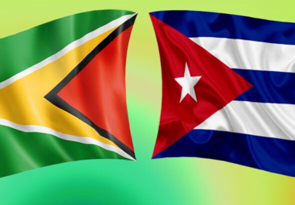 The flags of Guyana and Cuba. Photo: File photo.