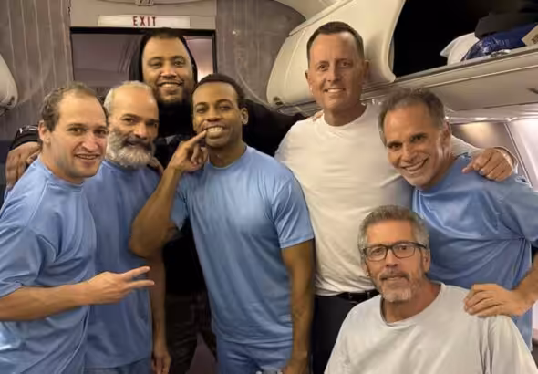 Six US nationals detained in Venezuela head home to the US with Donald Trump's envoy for special missions, Richard Grenell (third from right). The names of those released have been kept in reserve. Photo: X/@RichardGrenell.