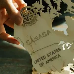 Art showing Canada and the US Empire as a single wood block. Photo: Lara Jameson.