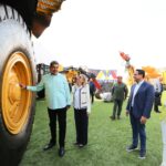 President Maduro stands in front of a massive tire. Photo: Venezuela Presidential Press.