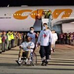 A Venezuelan migrant in a wheelchair being transported by Red Cross volunteers on Monday, March 24, 2025. Photo: MPPIJP.