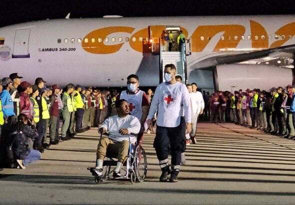 A Venezuelan migrant in a wheelchair being transported by Red Cross volunteers on Monday, March 24, 2025. Photo: MPPIJP.