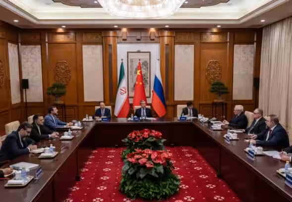Chinese Foreign Minister Wag Yi (C), Russian Deputy Foreign Minister Sergei Ryabkov (4th R), and Iranian Deputy Foreign Minister Kazem Gharibabadi (4th L) attend a meeting regarding the Iranian nuclear issue at Diaoyutai State Guest House on March 14, 2025 in Beijing, China. Photo: AFP.