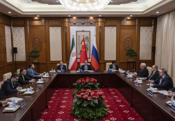 Chinese Foreign Minister Wag Yi (C), Russian Deputy Foreign Minister Sergei Ryabkov (4th R), and Iranian Deputy Foreign Minister Kazem Gharibabadi (4th L) attend a meeting regarding the Iranian nuclear issue at Diaoyutai State Guest House on March 14, 2025 in Beijing, China. Photo: AFP.