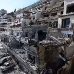 Syrian White Helmets rescuers check the site of an Israeli air strike on a building in Damascus in an area where Palestinian leaders are known to reside, on Mar. 13, 2025. Photo: AFP.