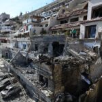 Syrian White Helmets rescuers check the site of an Israeli air strike on a building in Damascus in an area where Palestinian leaders are known to reside, on Mar. 13, 2025. Photo: AFP.