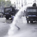 A demonstrator being hit by a water canon jet in the National Congress area, Buenos Aires, Argentina March 12, 2025. Photo: Damián Dopacio.