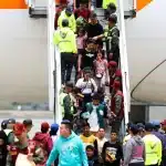 Venezuelan migrants arriving back home from Mexico on a Return to the Homeland Program flight, March 20, 2025. Photo: AFP.