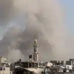 Smoke billows from an "Israeli" airstrike on Bureij camp in the central Gaza Strip, March 27, 2025. Photo: AFP.