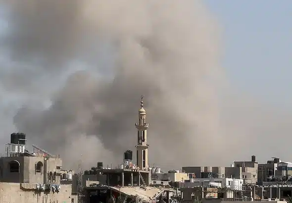 Smoke billows from an "Israeli" airstrike on Bureij camp in the central Gaza Strip, March 27, 2025. Photo: AFP.