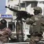 Terrorist organization HTS-affiliated security personnel in the Syrian coast. Photo: Omar Albam/AP.