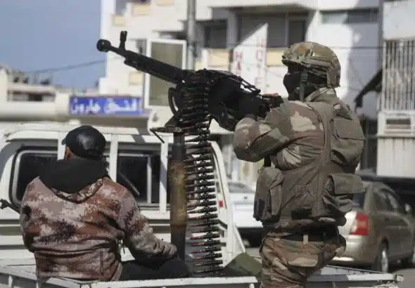 Terrorist organization HTS-affiliated security personnel in the Syrian coast. Photo: Omar Albam/AP.