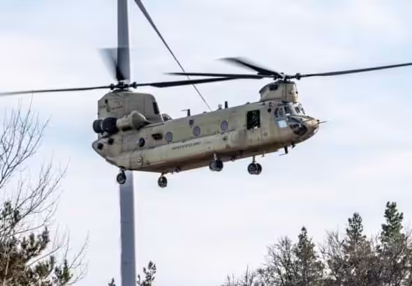 A CH-47F Chinook from the 1st Battalion, 214th Aviation Regiment, 12th Combat Aviation Brigade flies over the Grafenwoehr Training Area, Germany for aerial gunnery on March 3, 2025. Photo: US Army.