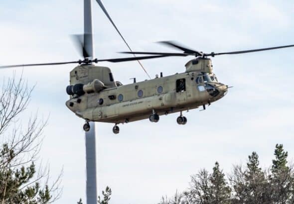 A CH-47F Chinook from the 1st Battalion, 214th Aviation Regiment, 12th Combat Aviation Brigade flies over the Grafenwoehr Training Area, Germany for aerial gunnery on March 3, 2025. Photo: US Army.