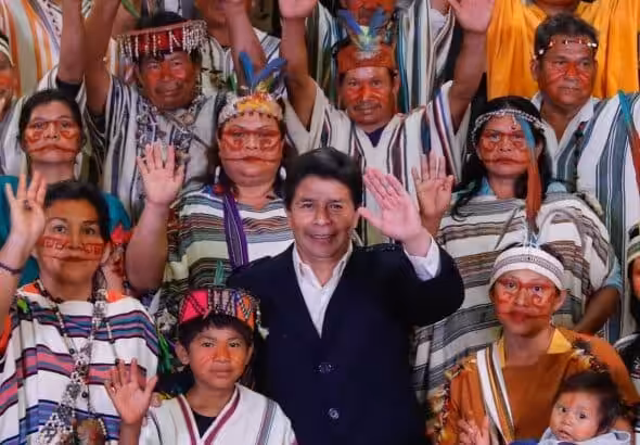 Peruvian President Pedro Castillo poses with a group of indigenous people during his electoral campaign. Photo: X/@PedroCastilloTe.
