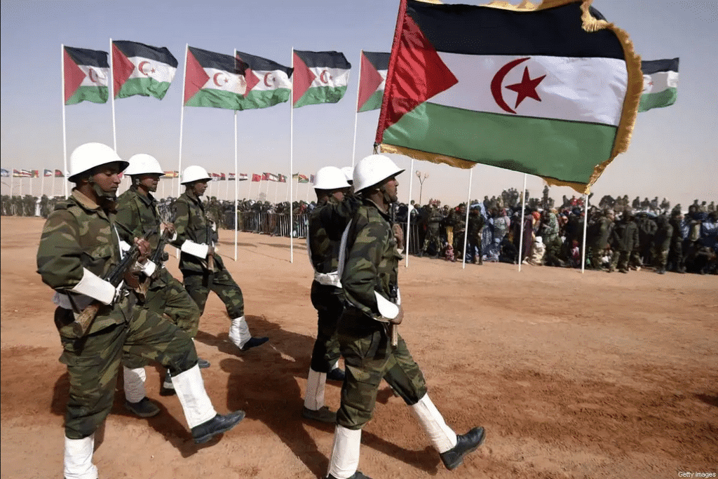 Members of the Sahrawi People’s Liberation Army parade with Polisario Front’s flags in the Sahrawi Arab Democratic Republic, February 27, 2016. Photo: Farouk Batiche/AFP.