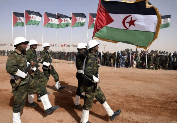 Members of the Sahrawi People’s Liberation Army parade with Polisario Front’s flags in the Sahrawi Arab Democratic Republic, February 27, 2016. Photo: Farouk Batiche/AFP.