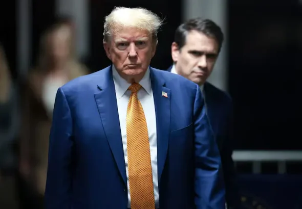 Donald Trump, accompanied by his attorney Todd Blanche, leaves a New York court on May 7, 2024. Photo: Win McNamee/AP.