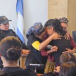 Young Mapuche woman Victoria Núñez Fernández embraces family members in court after being sentenced to two months of preventive detention for alleged arson. Photo: X/@monschlotthauer.