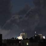A plume of smoke billows over Sana'a, capital of Yemen, following US-British airstrikes, March 15, 2025. Photo: AFP.