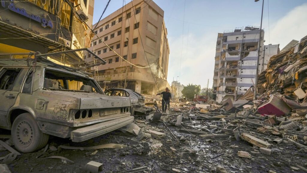 Damaged buildings and vehicles following an Israeli airstrike in southern Beirut, on Oct. 4.Photographer: Photo: Hassan Ammar/AP Photo.