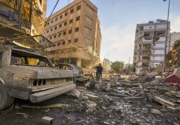 Damaged buildings and vehicles following an Israeli airstrike in southern Beirut, on Oct. 4.Photographer: Photo: Hassan Ammar/AP Photo.