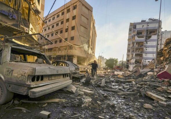 Damaged buildings and vehicles following an Israeli airstrike in southern Beirut, on Oct. 4.Photographer: Photo: Hassan Ammar/AP Photo.