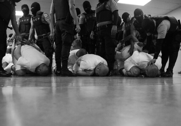 Venezuelans deported by the US government to El Salvador being treated like terrorists. Photo: Philip Holsinger/Time.