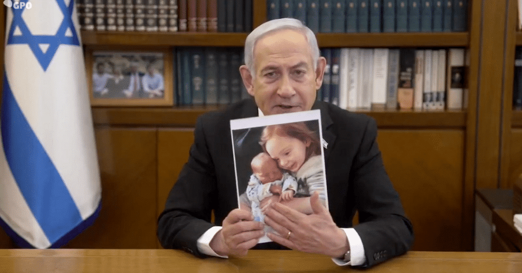Benjamin Netanyahu with a photograph. Photo: Caitlin Johnstone/File photo.