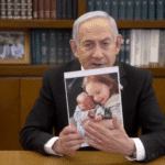 Benjamin Netanyahu with a photograph. Photo: Caitlin Johnstone/File photo.