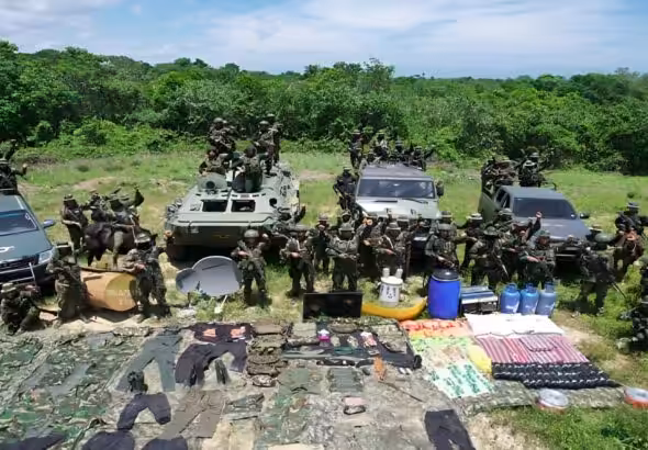 Venezuelan military personnel pose with part of the drugs and equipment seized during the Lightning of Catatumbo security operation in Zulia state. Photo: CEOFANB.