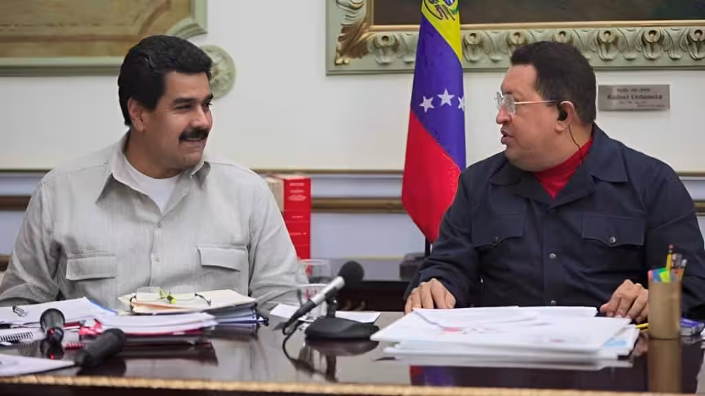 Then-Venezuelan Vice President Nicolás Maduro smiling next to President Hugo Chávez during a televised meeting at Miraflores Palace, Caracas, in 2013, a few weeks before Hugo Chávez's passing. Photo: Presidential Press.