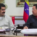 Then-Venezuelan Vice President Nicolás Maduro smiling next to President Hugo Chávez during a televised meeting at Miraflores Palace, Caracas, in 2013, a few weeks before Hugo Chávez's passing. Photo: Presidential Press.