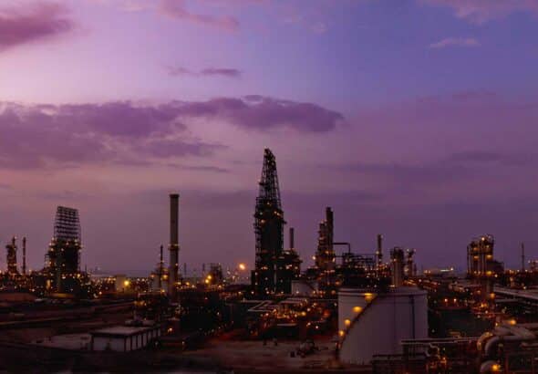 An oil refinery stretches into the purple horizon. Photo: Chevron.