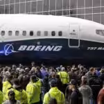 Boeing employees surround the 737 MAX, the MAX 7, after it rolled out last year in Renton. Boeing hired thousands of workers in Washington state and companywide in 2018. Photo: Elaine Thompson/AP Photo.