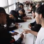 Venezuelan repatriates from the US are attended to by Venezuelan authorities after arriving at the Simón Bolívar Airport. Photo: Con El Mazo Dando.