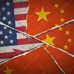 The US and Chinese flags spliced together, showing cracks. File photo.