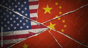 The US and Chinese flags spliced together, showing cracks. File photo.