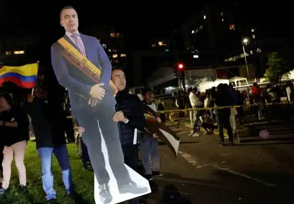 Supporters of Ecuador's President Daniel Noboa gather outside National Electoral Council (CNE) building, in Quito, Ecuador, on April 13, 2025. Photo: Daniel Becerril/Reuters.