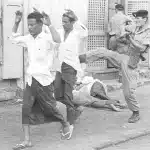 A British soldier kicks anti-colonial demonstrators in Yemen, 1967. Keir Starmer bombed the country last month. Photo: Alamy/AP.