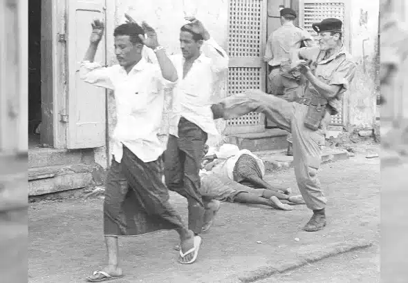 A British soldier kicks anti-colonial demonstrators in Yemen, 1967. Keir Starmer bombed the country last month. Photo: Alamy/AP.
