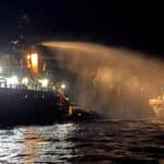 A tug vessel puts out a fire on the Gaza Freedom Flotilla vessel, Conscience, off the coast of Malta on May 2, 2025. Photo: Malta Government Department of Information via Reuters.