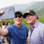 Colombian President Gustavo Petro (right) being photographed by a person during his visit to the Great Wall of China near Beijing on Monday, May 12, 2025. Photo: Colombia's Presidential Office.