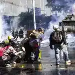Colombian protesters confront security forces amidst tear gas and water cannons. Photo: Colombia Informa.