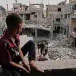 Palestinians inspect the rubble of homes destroyed by Israeli strikes in Khan Younis, Gaza Strip, May 15, 2025. Photo: Abdel Kareem Hana/AP.