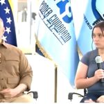 Venezuelan Attorney General Tarek William Saab with the mother of the two-year old child seized by the US authorities. Photo: RedRadioVE.