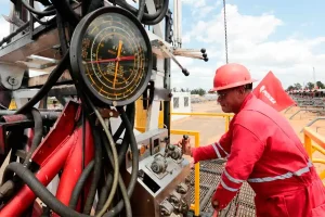 A Venezuelan oil worker operates a drill. Photo: PDVSA.